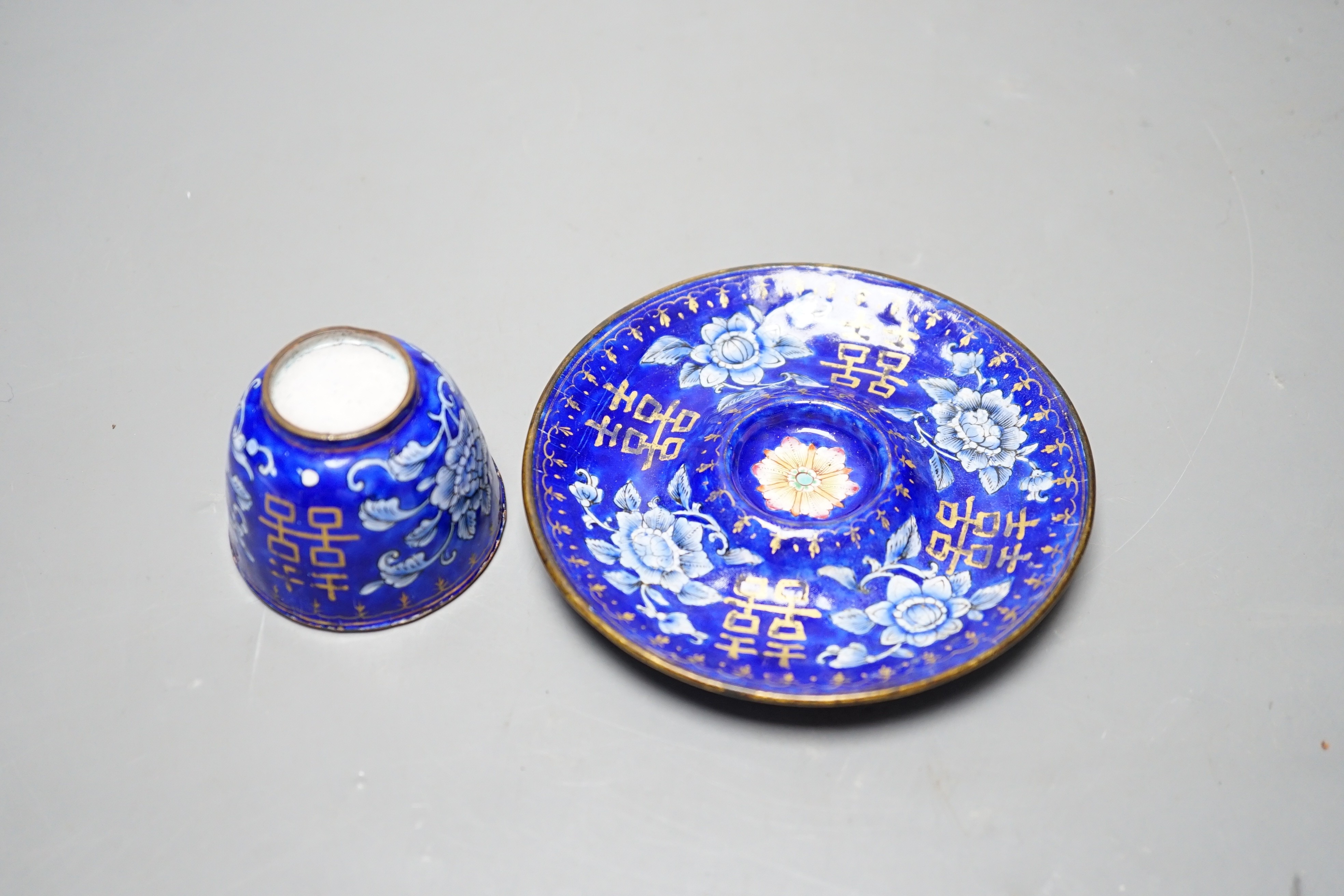 A 19th century Chinese Guangzhou enamel cup and saucer, 11cm diameter